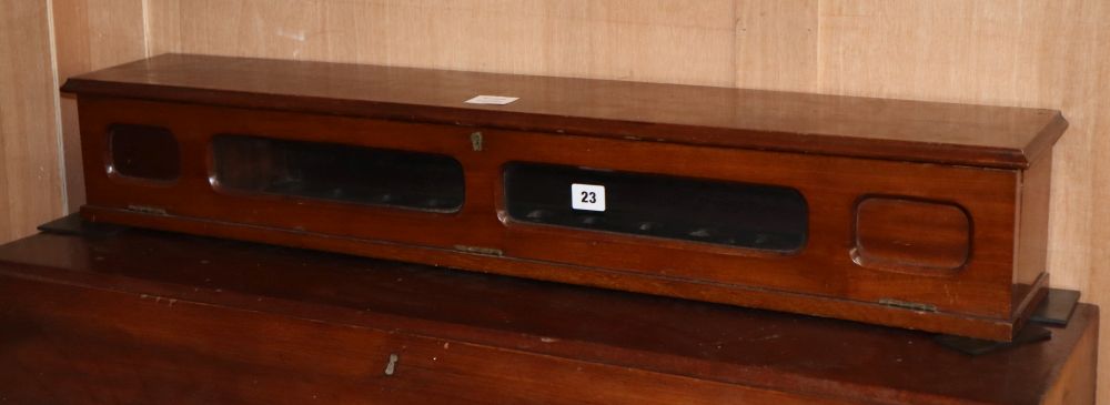 A glazed mahogany fall front display case, W.65cm, D.16cm, H.15cm